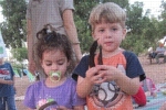 Children show the carob they harvested